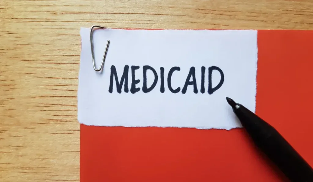 Medicaid writting on table background.