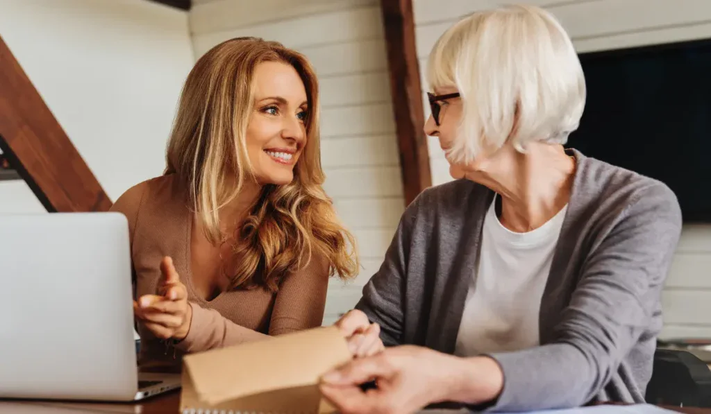 consulting with retired woman at home.